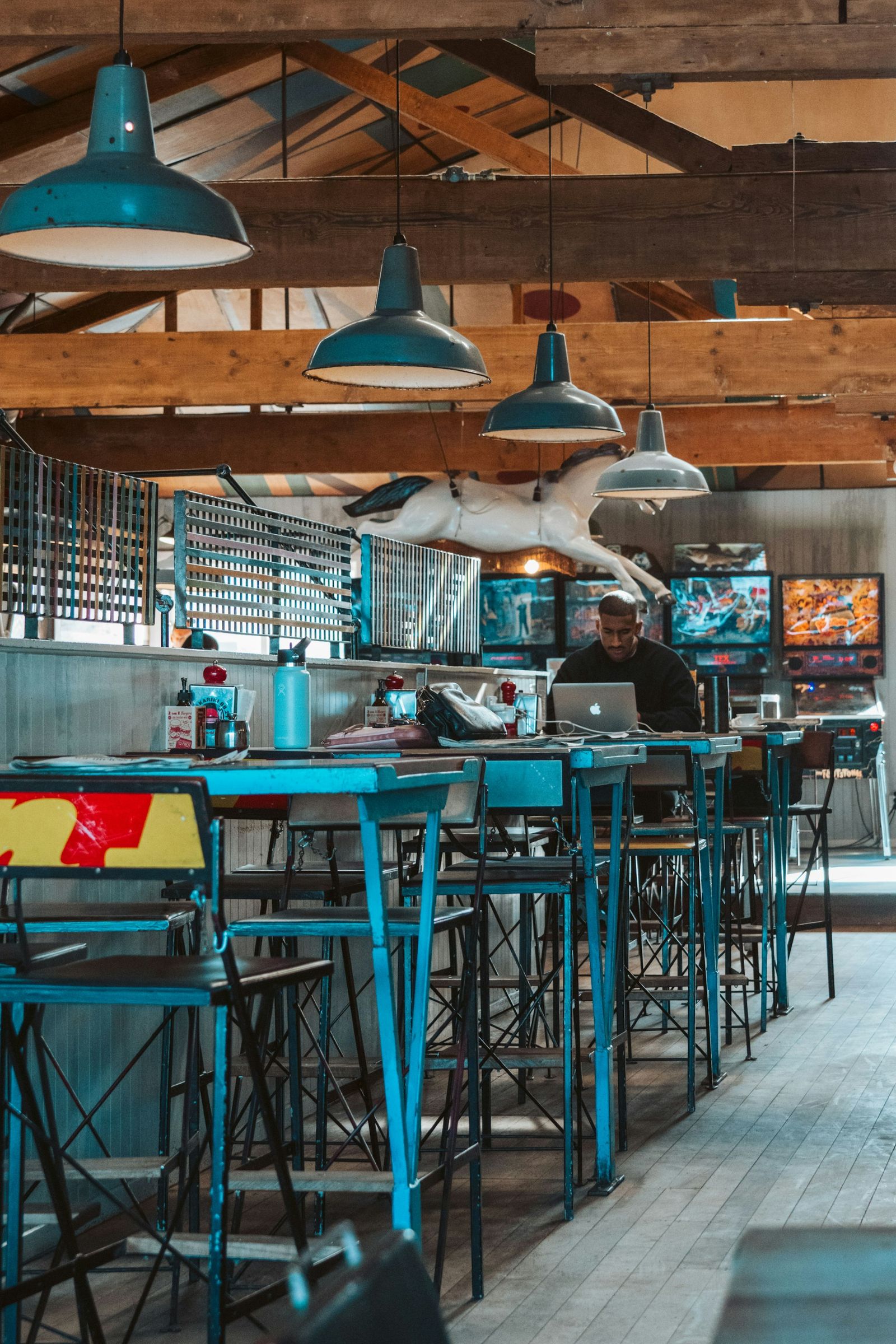 Retro-styled cafe with blue tables and chairs in Petone, Lower Hutt